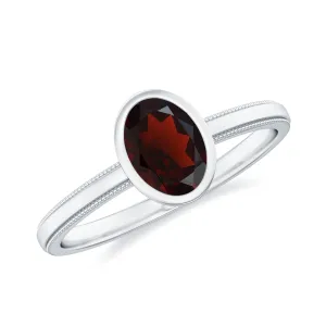 Bezel Set Oval Garnet Solitaire Ring with Beaded Detailing