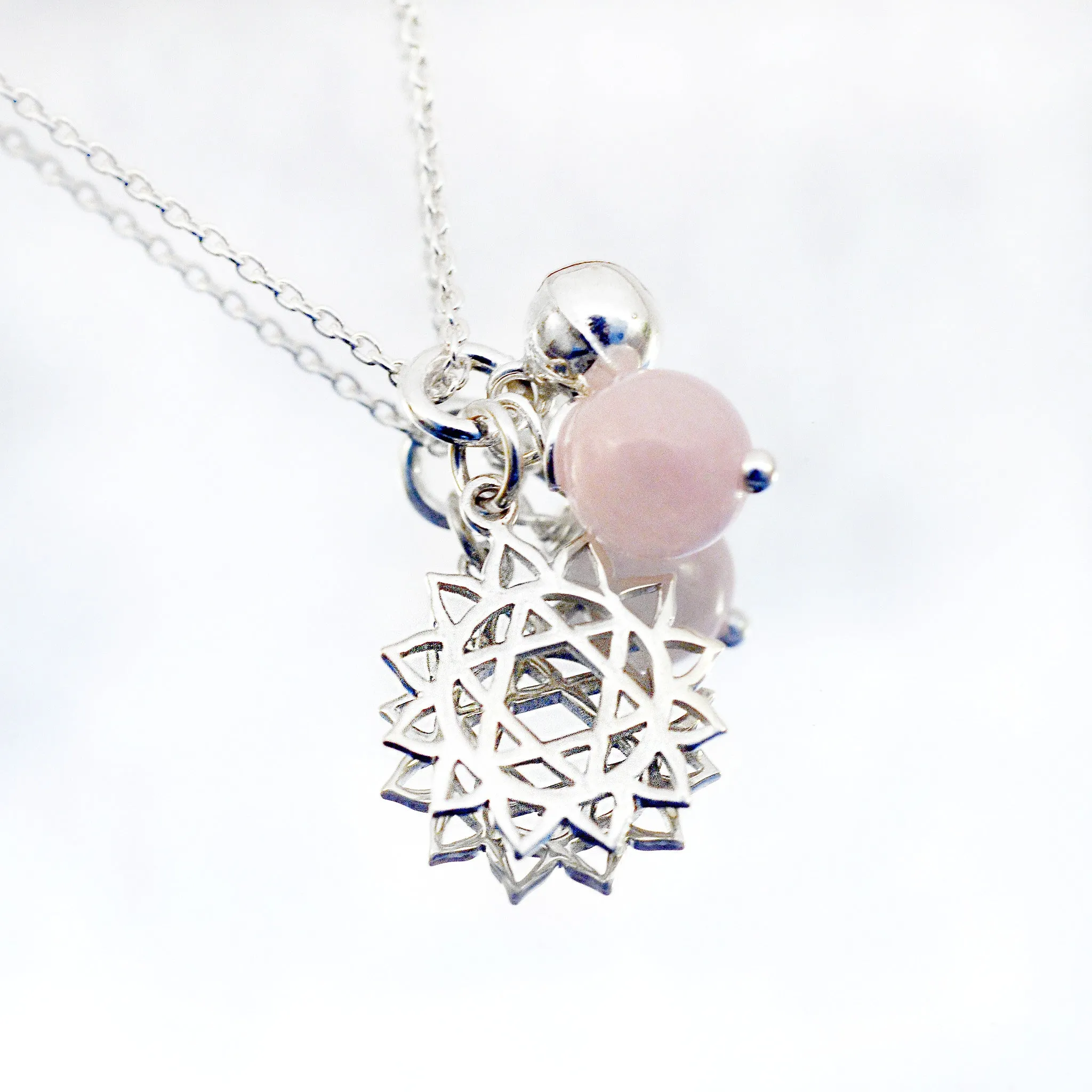 heart chakra symbol necklaces with rose quartz