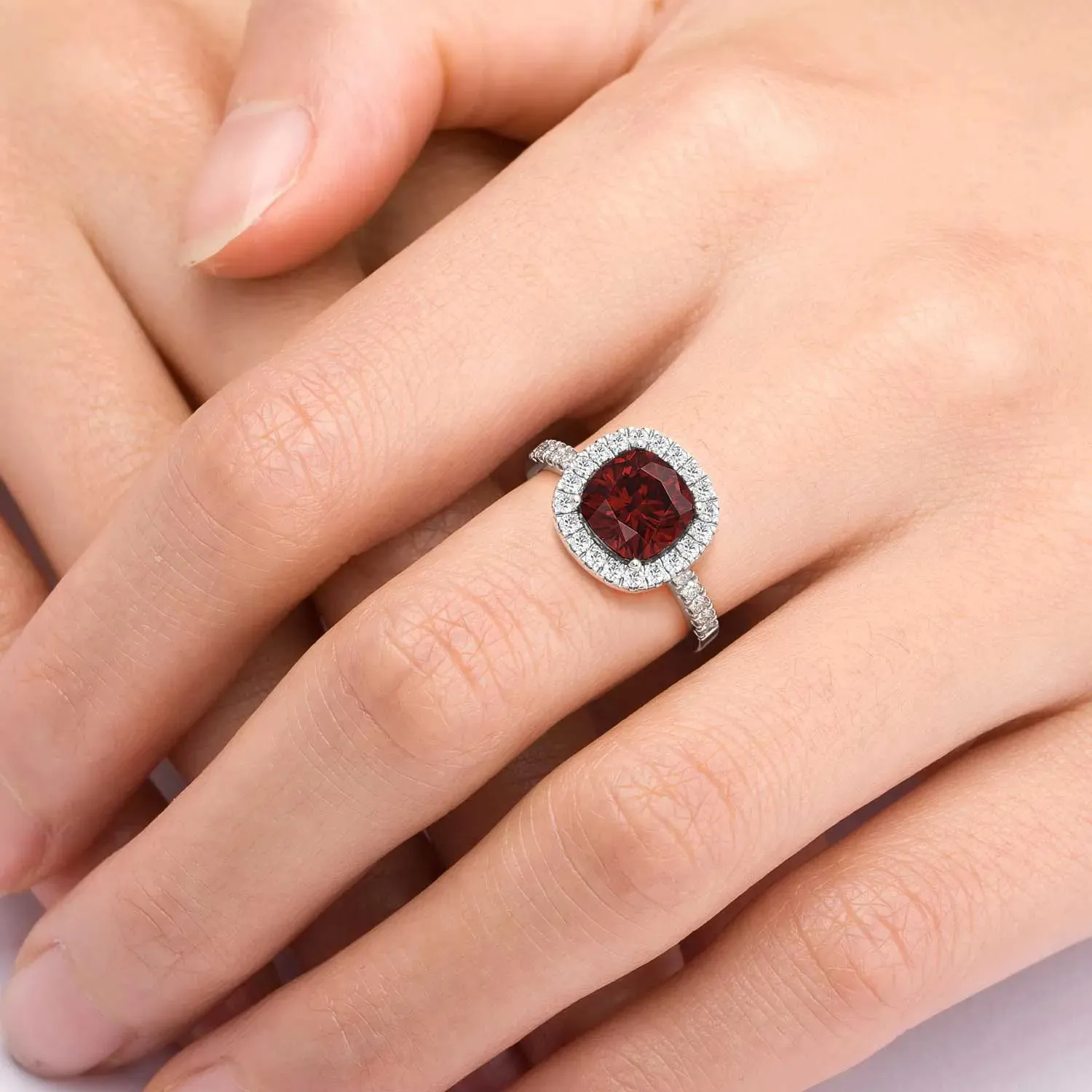 Radiant Majesty: Sterling Silver Garnet Halo Statement Ring